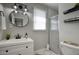 Bright bathroom features a modern sink, glass-enclosed shower, and neutral decor, providing a clean and updated space at 4714 N Miller Rd, Scottsdale, AZ 85251