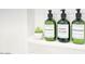 Bathroom showing shampoo, body wash, and conditioner bottles on shower shelf at 4714 N Miller Rd, Scottsdale, AZ 85251