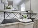 Bathroom featuring a modern sink, matte black faucet, and decorative backsplash, offering a stylish and functional space at 4714 N Miller Rd, Scottsdale, AZ 85251
