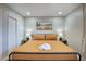 Well-lit bedroom with a comfortable bed and stylish bedside decor at 4714 N Miller Rd, Scottsdale, AZ 85251