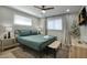 Comfortable bedroom with a ceiling fan, two windows with coverings, bedside lamps, and stylish rug at 4714 N Miller Rd, Scottsdale, AZ 85251