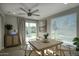 Comfortable dining area with views of the backyard with bright natural light and comfortable seating at 4714 N Miller Rd, Scottsdale, AZ 85251