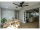 Bright dining area with natural light, a modern ceiling fan, and an open layout perfect for entertaining guests at 4714 N Miller Rd, Scottsdale, AZ 85251