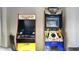 Retro game room showcasing Pac-Personal and Big Buck Hunter arcade machines at 4714 N Miller Rd, Scottsdale, AZ 85251