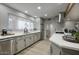 Bright modern kitchen featuring stainless steel appliances and a breakfast bar at 4714 N Miller Rd, Scottsdale, AZ 85251