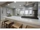 Bright modern kitchen island with seating and modern appliances at 4714 N Miller Rd, Scottsdale, AZ 85251