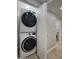 Convenient laundry area with stacked washer and dryer units at 4714 N Miller Rd, Scottsdale, AZ 85251