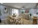 Open-concept living room with stylish decor, modern ceiling fan, and a seamless flow for versatile entertaining at 4714 N Miller Rd, Scottsdale, AZ 85251