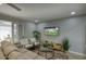 Cozy living space featuring comfortable seating, a modern entertainment center, and stylish decor for relaxed living at 4714 N Miller Rd, Scottsdale, AZ 85251