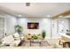 Bright living room with contemporary furniture, decorative rug, and mounted TV perfect for relaxed living at 4714 N Miller Rd, Scottsdale, AZ 85251
