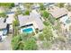 This house features a large backyard pool with desert landscaping and a covered patio at 6069 E Ironwood Dr, Scottsdale, AZ 85266