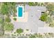 This house features a backyard pool, desert landscaping, and a unique roofline at 6069 E Ironwood Dr, Scottsdale, AZ 85266