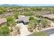This house features desert landscaping, a three car garage, and a mountain view at 6069 E Ironwood Dr, Scottsdale, AZ 85266