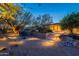 Inviting backyard with outdoor grill and desert landscaping, perfect for enjoying the natural surroundings at 6069 E Ironwood Dr, Scottsdale, AZ 85266