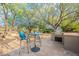 Outdoor kitchen featuring a dining table, chairs, and a built-in barbeque at 6069 E Ironwood Dr, Scottsdale, AZ 85266