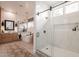 Bright bathroom featuring a walk-in shower, soaking tub, and dual vanity at 6069 E Ironwood Dr, Scottsdale, AZ 85266