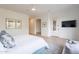 Serene bedroom featuring a cozy bed, stylish decor, and a view to the outdoors at 6069 E Ironwood Dr, Scottsdale, AZ 85266