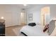Bedroom with wood flooring, a closet, and ensuite bathroom at 6069 E Ironwood Dr, Scottsdale, AZ 85266
