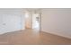 Bedroom with hardwood floors, closet, and access to other rooms in the house at 6069 E Ironwood Dr, Scottsdale, AZ 85266