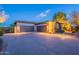 Spacious three-car garage with stone accents, offering ample parking and storage space at 6069 E Ironwood Dr, Scottsdale, AZ 85266