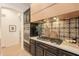 Gourmet kitchen featuring stainless steel appliances, sleek countertops, and a stylish tiled backsplash at 6069 E Ironwood Dr, Scottsdale, AZ 85266