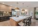 Bright kitchen featuring a large island, stainless steel appliances, and seamless access to dining area at 6069 E Ironwood Dr, Scottsdale, AZ 85266