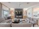 Relax in this stylish living room featuring built-ins, a fireplace and plenty of seating at 6069 E Ironwood Dr, Scottsdale, AZ 85266