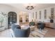 Cozy living room featuring stylish decor, wine rack and neutral color palette, perfect for relaxing or entertaining at 6069 E Ironwood Dr, Scottsdale, AZ 85266