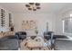 Inviting living room featuring stylish decor, wine rack and neutral color palette, bathed in natural light at 6069 E Ironwood Dr, Scottsdale, AZ 85266