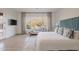 Bright main bedroom with a large window and a lounge, perfect for relaxation at 6069 E Ironwood Dr, Scottsdale, AZ 85266