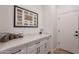 Walk-in pantry includes custom cabinetry, great storage space, and stylish countertops and hardware at 6069 E Ironwood Dr, Scottsdale, AZ 85266
