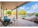 Covered patio featuring desert landscaping and a view of the refreshing pool at 6069 E Ironwood Dr, Scottsdale, AZ 85266
