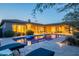 Backyard pool surrounded by patio seating, desert plants and landscape lighting at 6069 E Ironwood Dr, Scottsdale, AZ 85266