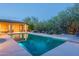 Sparkling swimming pool with desert landscaping, a covered patio, and inviting lounge area at 6069 E Ironwood Dr, Scottsdale, AZ 85266