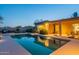 Inviting pool with clear water and lush landscaping, perfect for relaxation and entertaining at twilight at 6069 E Ironwood Dr, Scottsdale, AZ 85266