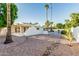 Spacious backyard with mature trees and desert landscaping, a perfect outdoor living space with a pool at 6119 E Sandra Ter, Scottsdale, AZ 85254