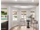 Bright dining area with patio access and views of the outdoor pool and seating area at 6119 E Sandra Ter, Scottsdale, AZ 85254