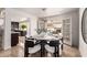 Elegant dining room featuring access to a patio with stainless steel grill and outdoor seating at 6119 E Sandra Ter, Scottsdale, AZ 85254