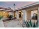 Inviting entryway with tiled floor, stucco columns, and a covered porch at 6119 E Sandra Ter, Scottsdale, AZ 85254