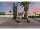 Charming single-story home featuring desert landscaping, gravel, and a well-maintained yard at sunset at 6119 E Sandra Ter, Scottsdale, AZ 85254