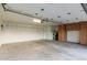 Spacious garage with ample storage cabinets, featuring organized storage and lighting at 6119 E Sandra Ter, Scottsdale, AZ 85254