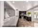 Well-equipped kitchen featuring stainless steel appliances and views to outdoor area with pool at 6119 E Sandra Ter, Scottsdale, AZ 85254