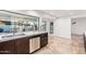 Bright kitchen featuring sleek countertops, modern appliances, and light-filled views to the backyard at 6119 E Sandra Ter, Scottsdale, AZ 85254