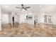 Open concept living room featuring tile floors, a ceiling fan, and natural light at 6119 E Sandra Ter, Scottsdale, AZ 85254