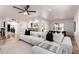 Bright living room featuring a modern couch and open access to other living spaces at 6119 E Sandra Ter, Scottsdale, AZ 85254