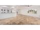 Bright living room with tile flooring, large windows, and an open layout at 6119 E Sandra Ter, Scottsdale, AZ 85254