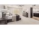 A serene main bedroom featuring a king bed, neutral tones, and a well-lit bathroom at 6119 E Sandra Ter, Scottsdale, AZ 85254