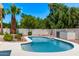 Inviting pool surrounded by a concrete patio and desert landscaping with beautiful lush trees at 6119 E Sandra Ter, Scottsdale, AZ 85254