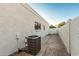 Brick-paved side yard showing air conditioning unit, and the back gate leading to the exterior area at 6119 E Sandra Ter, Scottsdale, AZ 85254