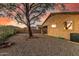 Cozy backyard with desert landscaping, a covered patio, and space for outdoor enjoyment at 6520 E Hacienda La Noria Ln, Gold Canyon, AZ 85118